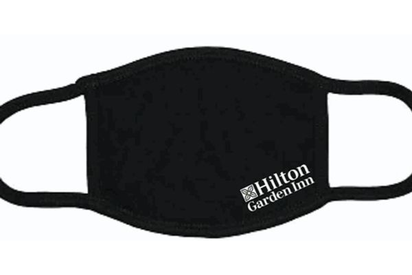 A black face mask with the hilton garden inn logo.