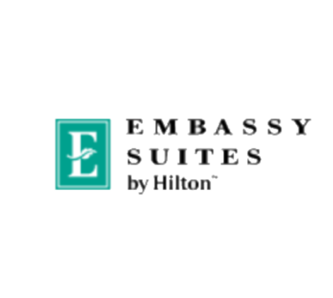 A logo of embassy suites by hilton